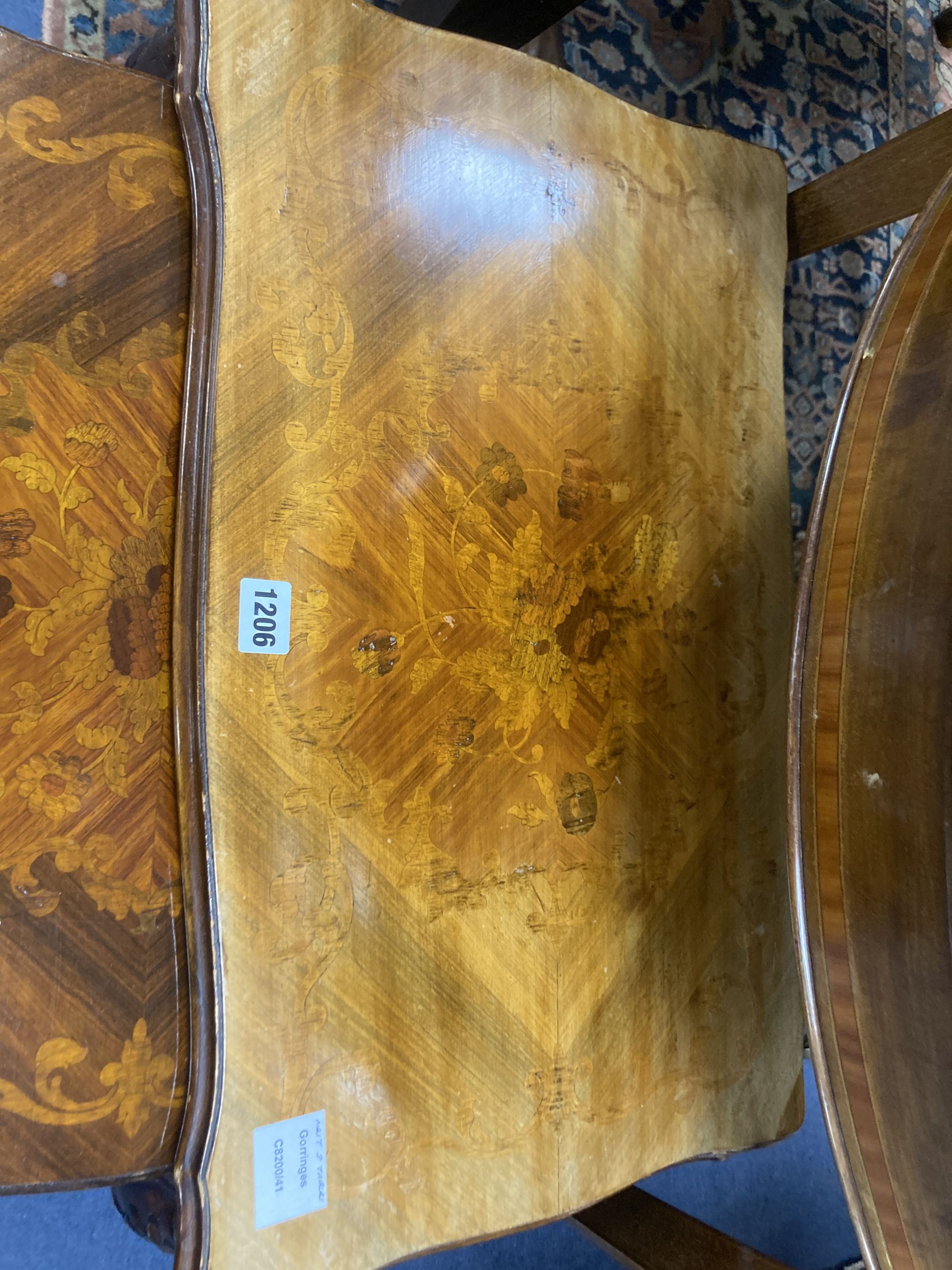 A nest of three marquetry inlaid walnut tea tables, width 59cm, depth 36cm, height 49cm